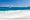 Widok na żaglówkę, głazy i Ocean Indyjski z plaży Petite Anse